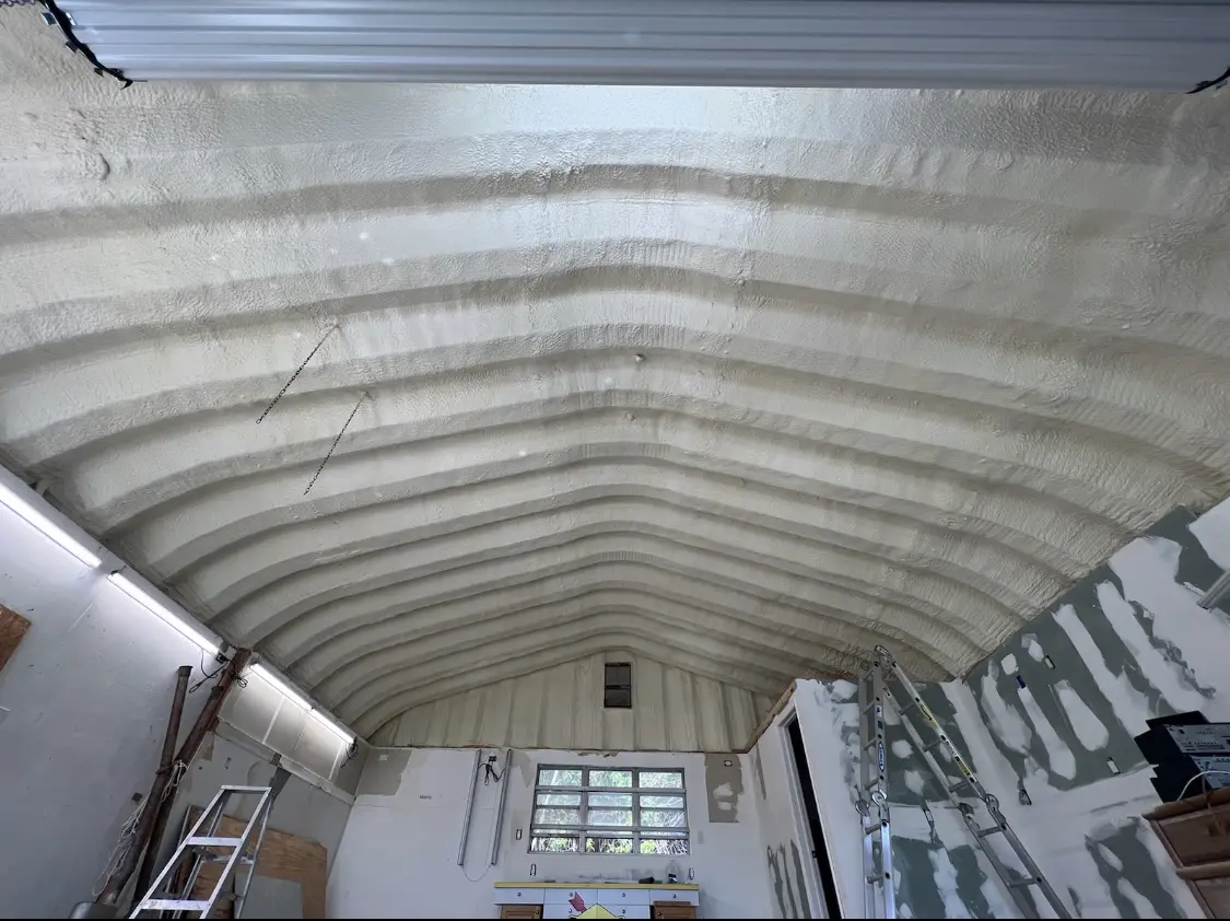 Spray polyurethane foam applied to the underside of a metal roof deck in West Manheim